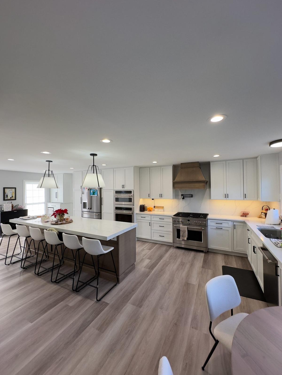Full kitchen remodel with island pendant lighting and recessed lighting