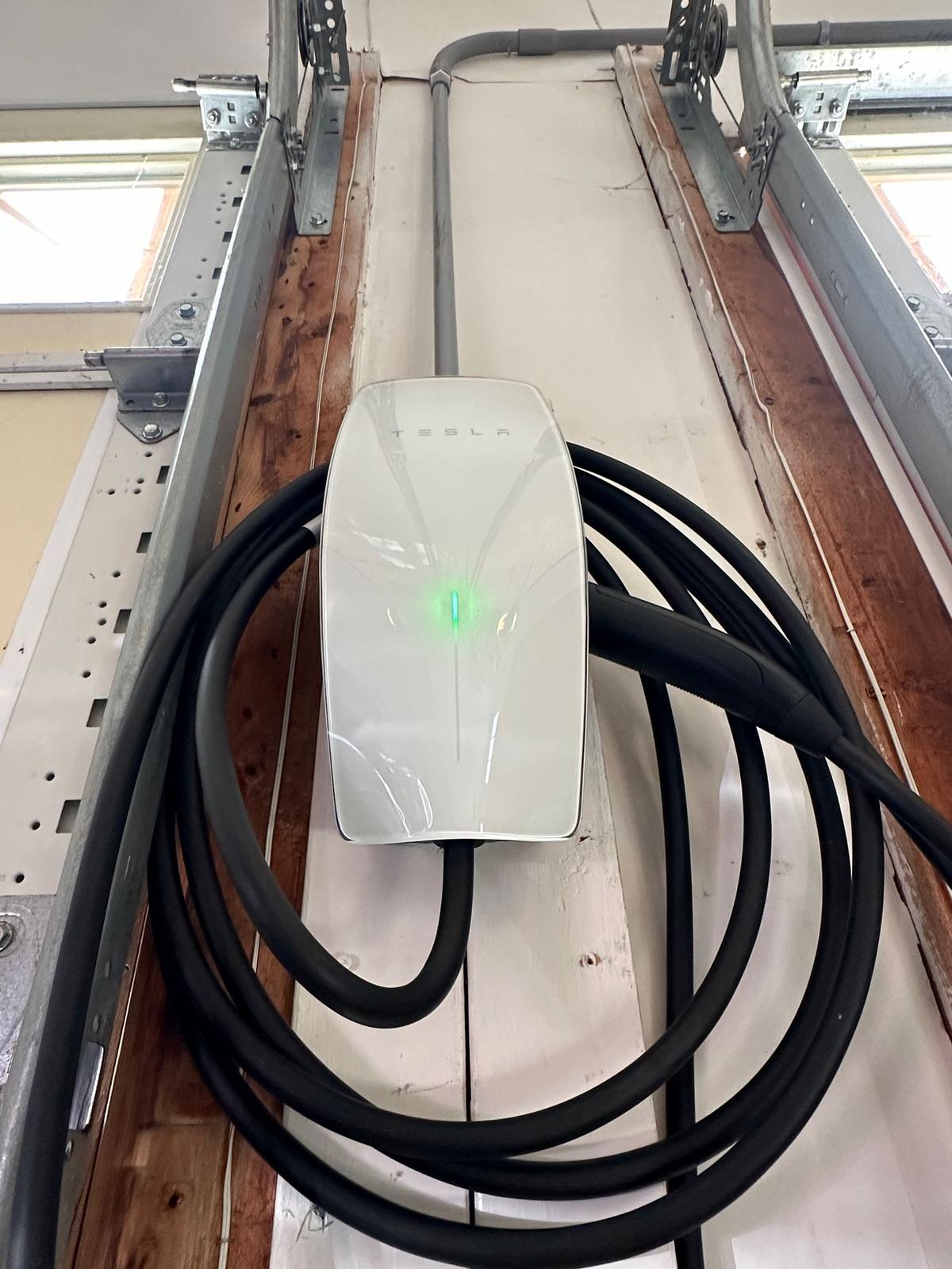 Tesla Wall Connector EV charger installed in home garage
