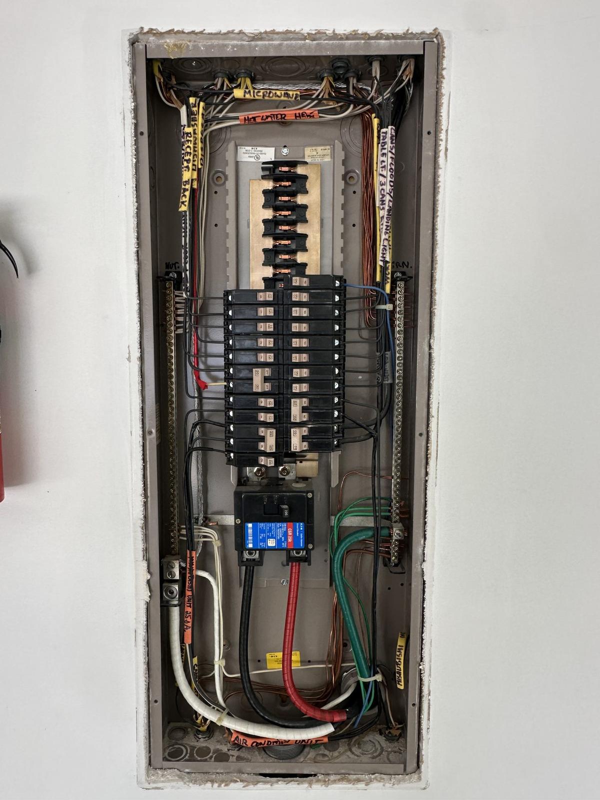 Newly installed 200 amp residential electrical panel with labeled circuit breakers